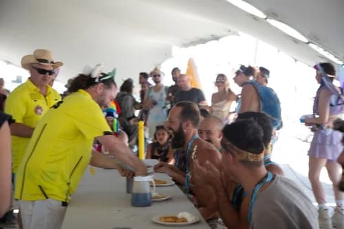 Waffles & House camp serving waffles at Burning Man